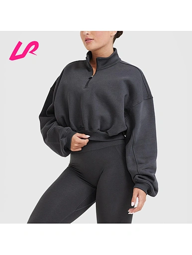 Stay comfy and stylish in our quarter zip crop sweatshirt. Made from soft, durable materials, it's perfect for casual wear. Shop now!